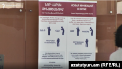 A sign at Yerevan's airport alerts passengers to the coronavirus risks.