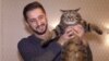 An (Almost) Purr-fect Plan: The Fat-Cat Fraudster On A Russian Flight video grab 2