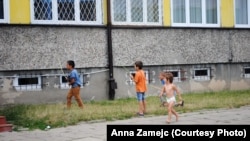 Children play outside an asylum-seekers' center in Bialystok.