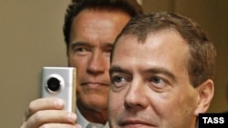 California Governor Arnold Schwarzenegger (rear) with visiting Russian President Dmitry Medvedev in June