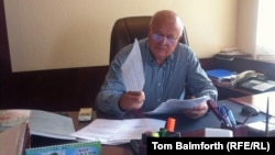 Yaroslav Pidgaynyi sits behind his desk in his office for the first time since he was chased out by corporate raiders.