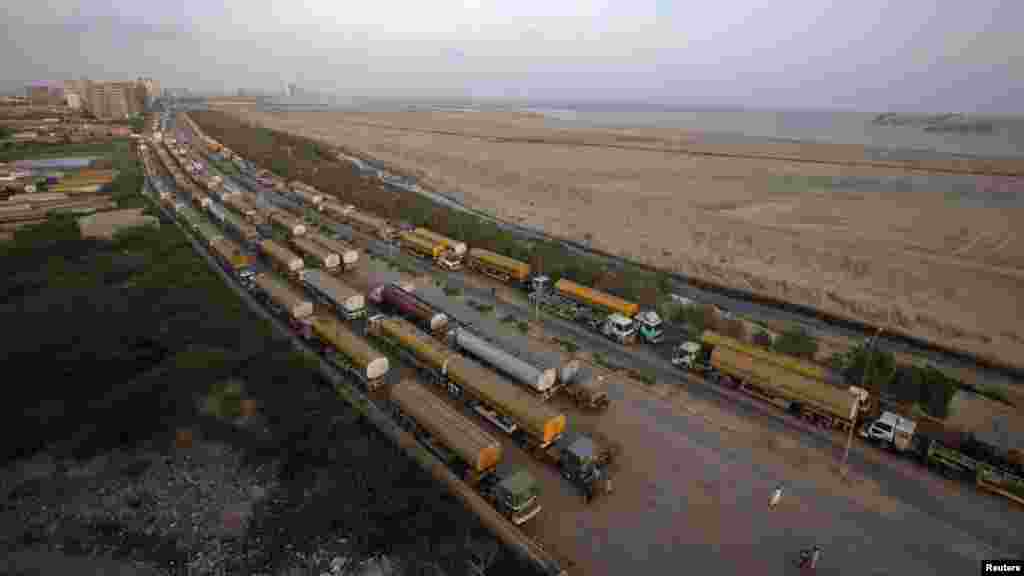 Fuel tankers are parked at a compound in Karachi on May 16.