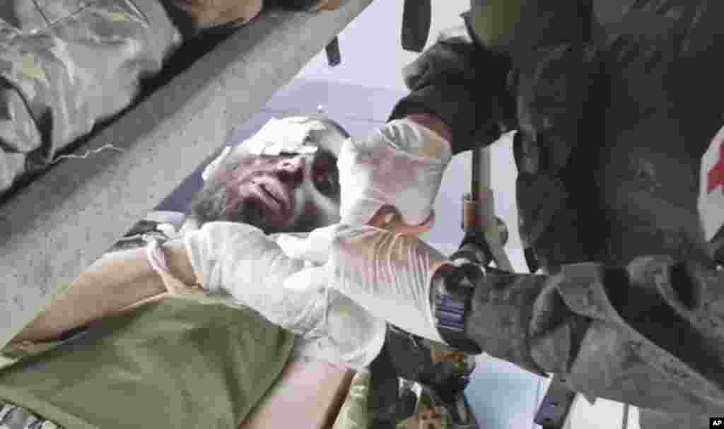 A video released by the Russian Defense Ministry shows a wounded Ukrainian soldier receiving treatment in a bus after being moved from the Azovstal steel plant.