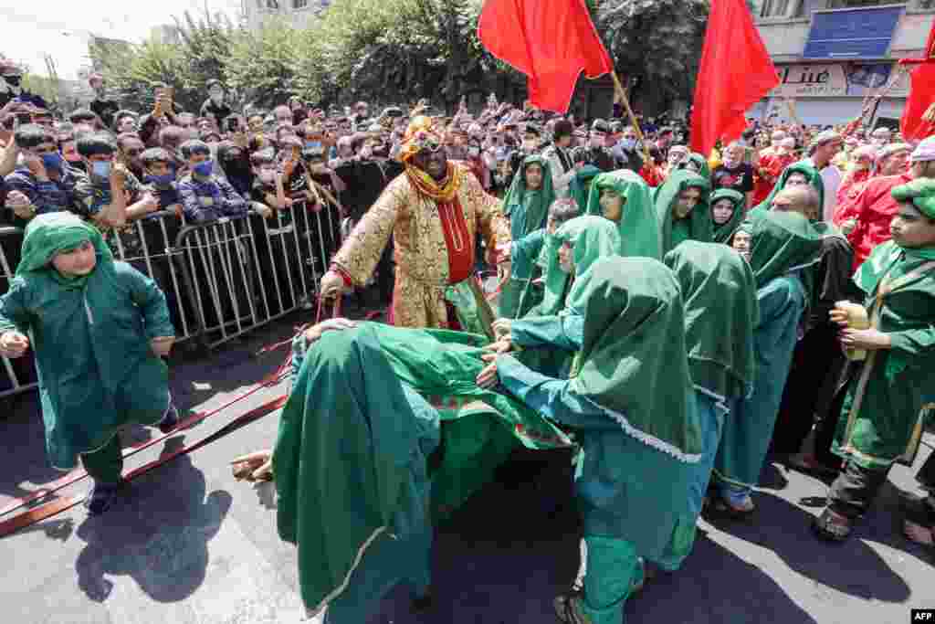 Children perform a reenactment on the 10th day of the month of Muharram, which marks the peak of Ashura.