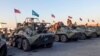 Russian military vehicles sent to monitor the truce in Nagorno-Karabakh are parked on the airfield in Yerevan on November 12.