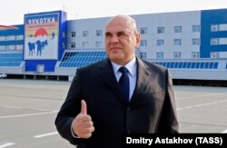 Prime Minister Mikhail Mishustin gives a thumbs up during a welcome ceremony at Petropavlovsk-Kamchatsky city airport in August, but had no answers about where the funds for a new hospital had gone.