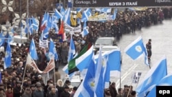 Union members march in Kyiv.