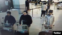 This police photo shows the two suspected suicide bombers in the airport attacks and an unidentified third man, at right.