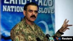 Lieutenant General Asim Bajwa, then the military's top spokesman, speaks during a news conference in Rawalpindi in September 2016.