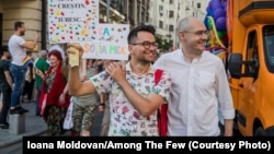 Victor Ciobotaru (left) and Florin Buhuceanu attend a gay-pride march in Bucharest in June.