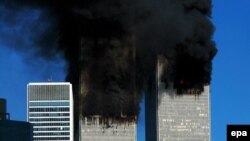 Smoke billows out of the burning World Trade Center towers before their collapse in New York on September 11, 2001.