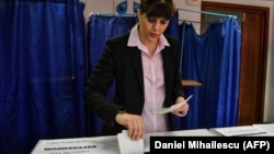 Laura Codruta Koevesi casts her ballot for the European elections at a polling station in Bucharest on May 26.