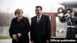 Macedonian Prime Minister Zoran Zaev (right) is welcomed to Berlin by German Chancellor Angela Merkel on February 21. 