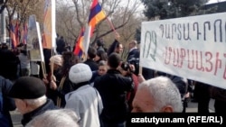 Armenians protest in front of the president's residence against Armenia joining the Russia-led Customs Union.