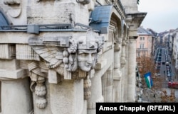 A sphinx watches over the streets of central Budapest from the corner of the Franz Liszt Academy of Music.