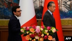 French Foreign Minister Stephane Sejourne (left) and his Chinese counterpart, Wang Yi, attend a joint press conference in Beijing on April 1. 