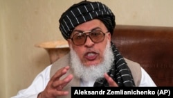 Sher Mohammad Abbas Stanikzai, the Taliban's chief negotiator, speaks to reporters after talks in Moscow in May.