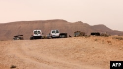 Tunisian military vehicles and Emirati Red Cross jeeps are parked near a border post with Libya (file photo).