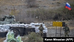 Russian peacekeepers are stationed outside the town of Kalbacar on November 18, in an area of Azerbaijan being vacated by ethnic Armenians after three decades.