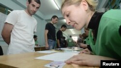 Georgia -- Inmates wait before receiving their ballots during the parliamentary election at a polling station at Gldani prison No. 8 in Tbilisi.