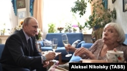 Russian President Vladimir Putin (left) congratulates Lyudmila Alekseyeva on her 90th birthday in Moscow on July 20, 2017.