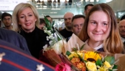 Russian Foreign Ministry spokeswoman Maria Zakharova (left) meets with Maria Butina upon her return to Moscow on October 26.