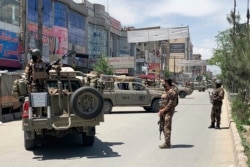 Afghan police arrive at the site of an attack in Kabul on May 12.