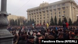 Protesters face off outside the regional administrative building in Kharkiv.