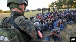 A group of migrants detained in Subotica, northern Serbia, on July 13, 2022