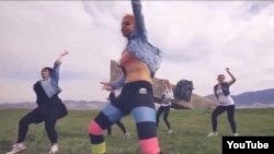 A screen grab from the music video on YouTube of six women dancing provocatively against the backdrop of a World War II memorial in Novorossiisk, Russia.