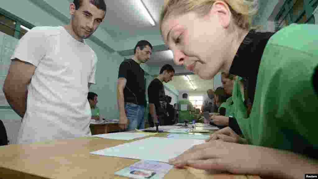 Inmates wait before receiving their ballots at a polling station in Tbilisi&#39;s Gldani Prison No. 8.