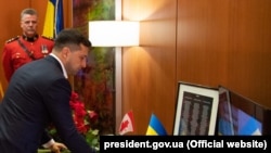 Ukrainian President Volodymyr Zelenskiy honors the victims of the tragedy at the Canadian Embassy in Kyiv.