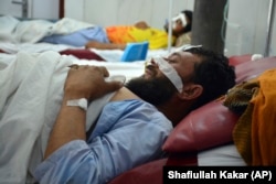 An Afghan man lies at a hospital after clashes between the Taliban and Afghan security forces in Laghman Province, east of Kabul, on May 24.