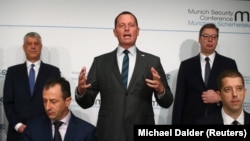 U.S. Ambassador to Germany Richard Grenell (center) speaks as Kosovar President Hashim Thaci (left) and Serbian President Aleksandar Vucic look on at the Munich Security Conference in Munich on February 14.