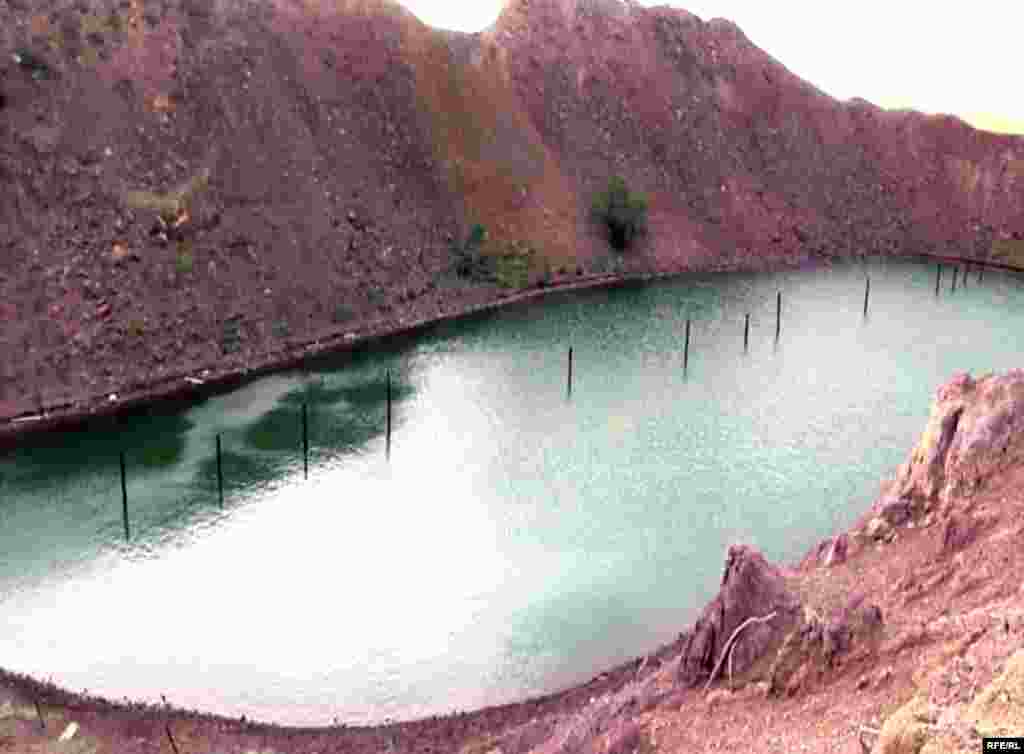 An &quot;atomic&quot; lake formed from a crater remaining after a series of nuclear explosions in the Semipalatinsk region.