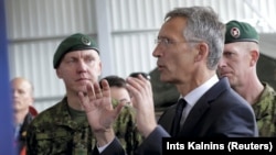 NATO Secretary-General Jens Stoltenberg speaks to Estonian soldiers at the Tapa military base on September 6.