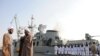 Clerics stand in front of the "Jamaran," Iran's first domestically built warship, during naval maneuvers in the Persian Gulf in February 2010.