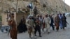 Afghan resistance forces patrol a road in Rah-e Tang, Panjshir Province, on August 29.