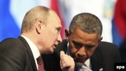 Russian President Vladimir Putin (left) and U.S. President Barack Obama confer at a G20 summit in 2012.