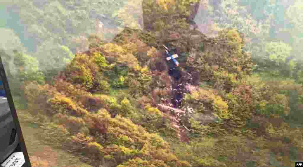 Iran&#39;s Red Crescent Society has released this picture, which appears to show pieces of the&nbsp; helicopter after it crashed. Iranian state television said on May 20 that the helicopter had fallen foul of poor weather conditions. 