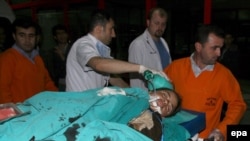 A wounded woman is taken to the hospital in Diyarbakir early on May 5. 