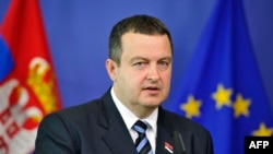 Serbian Prime Minister Ivica Dacic gives a press conference following a working session at EU headquarters in Brussels on June 26.