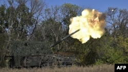 A Ukrainian AHS Krab self-propelled howitzer fires toward Russian positions near the front line in the Chasiv Yar area in the Donetsk region.