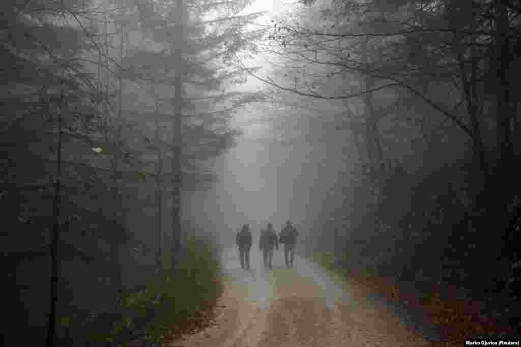 Migrants on a road near the Vucjak refugee camp in Bihac, Bosnia-Herzegovina, on October 30.