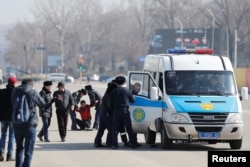 Kazakh police detain protesters during a rally held by opposition supporters in Almaty in March 2020.