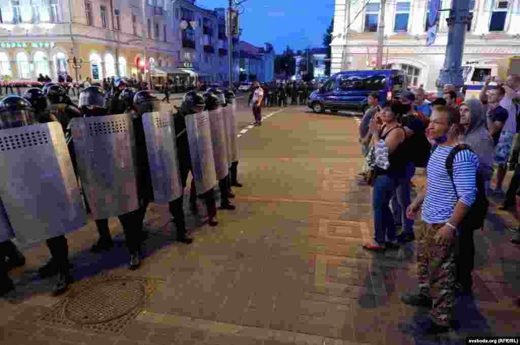 Anti-government protesters face off with security forces in Homel.