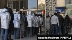 Members of Positive Change hold an action called "It's my turn" in Baku.