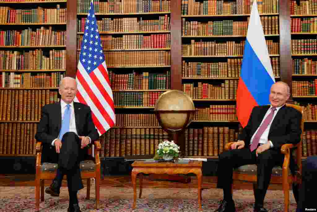 Biden and Putin inside a library in the historic villa.&nbsp;