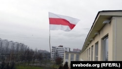 The banned Belarusian national flag flies in Vitebsk in December.