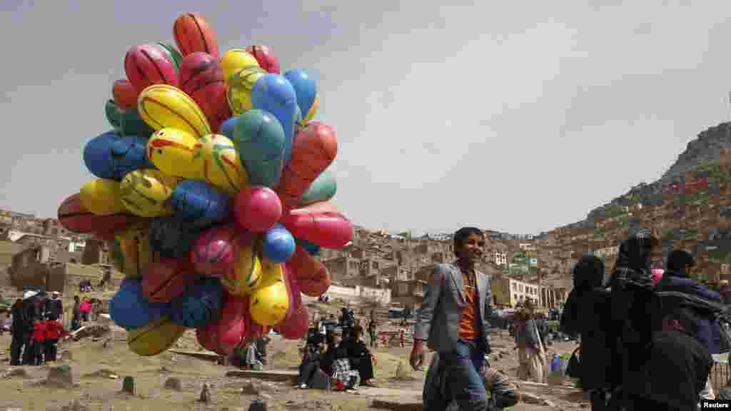 A boy sells balloons as the Norouz celebrations begin